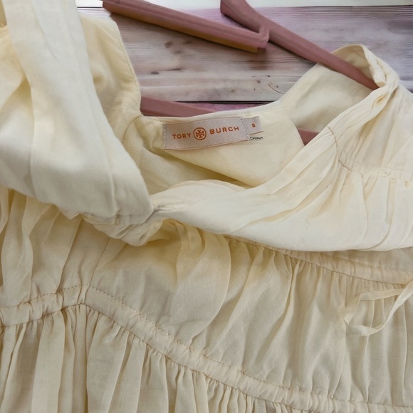 Tory Burch
Sleeveless Smocked Peplum Top COLOR New Ivory size 0 - Picture 16 of 17